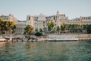 A view of traditional Parisian buildings from the banks of the Seine.