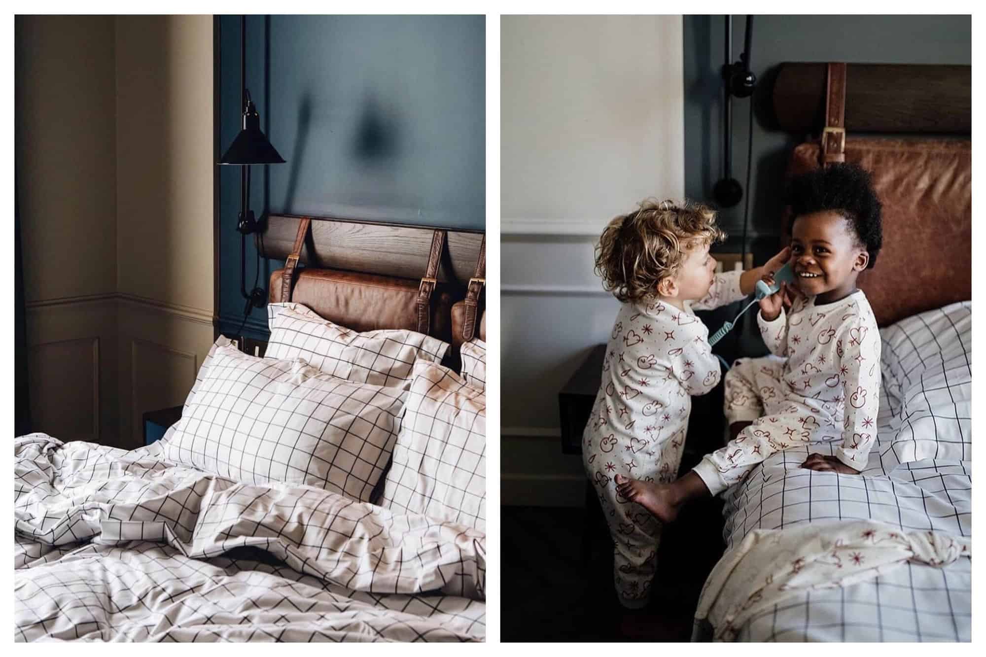 Left- A bed in front of a blue wll in a hotel room. 
Right- Two young boys in pajamas talk on the phone in a hotel room. 
