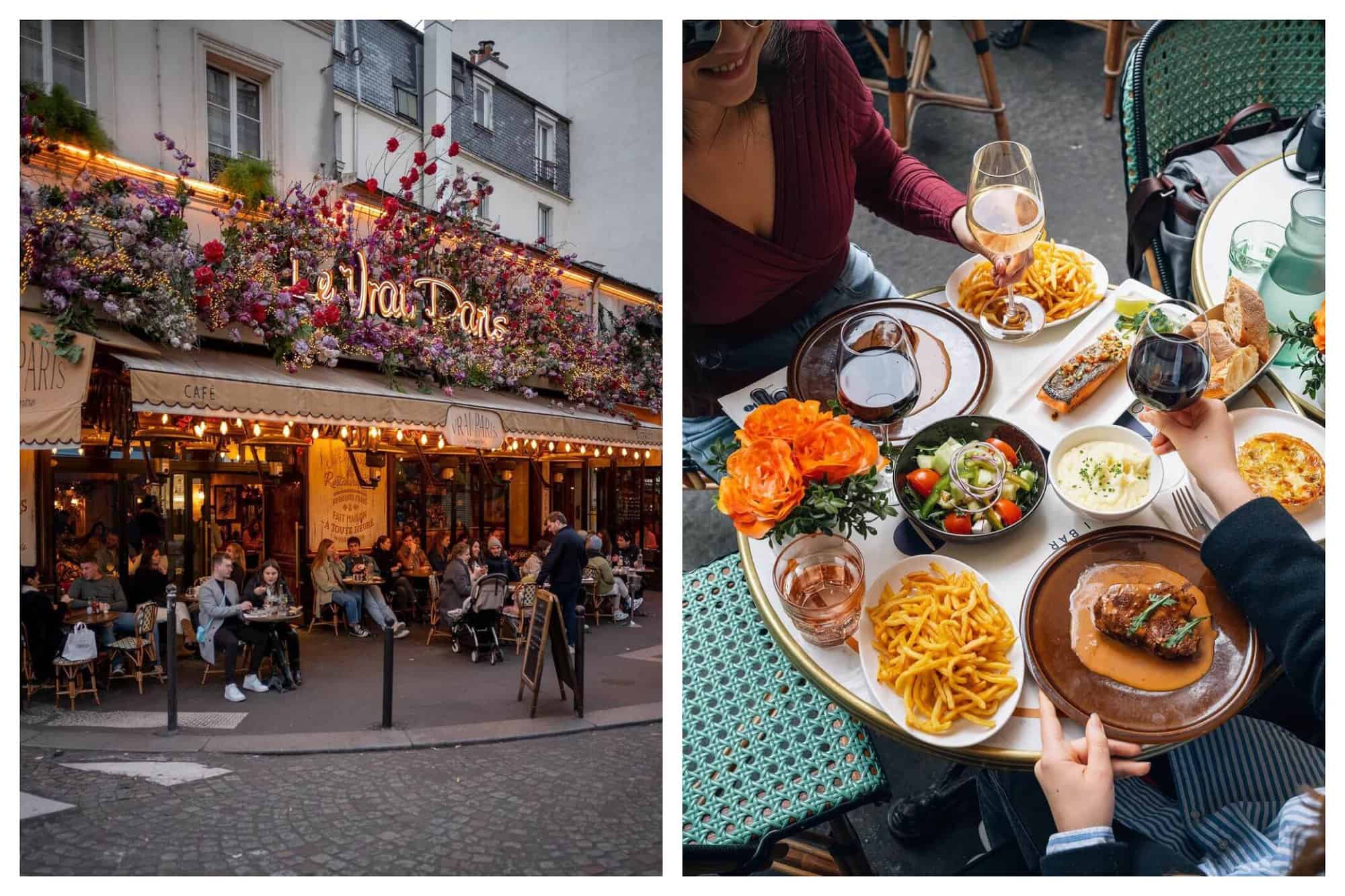 A bustling cafe, Le Vrai Paris with blooms of flowers around its sign and warm lighting. A couple sitting at a table full of French food and wine outside a cafe.