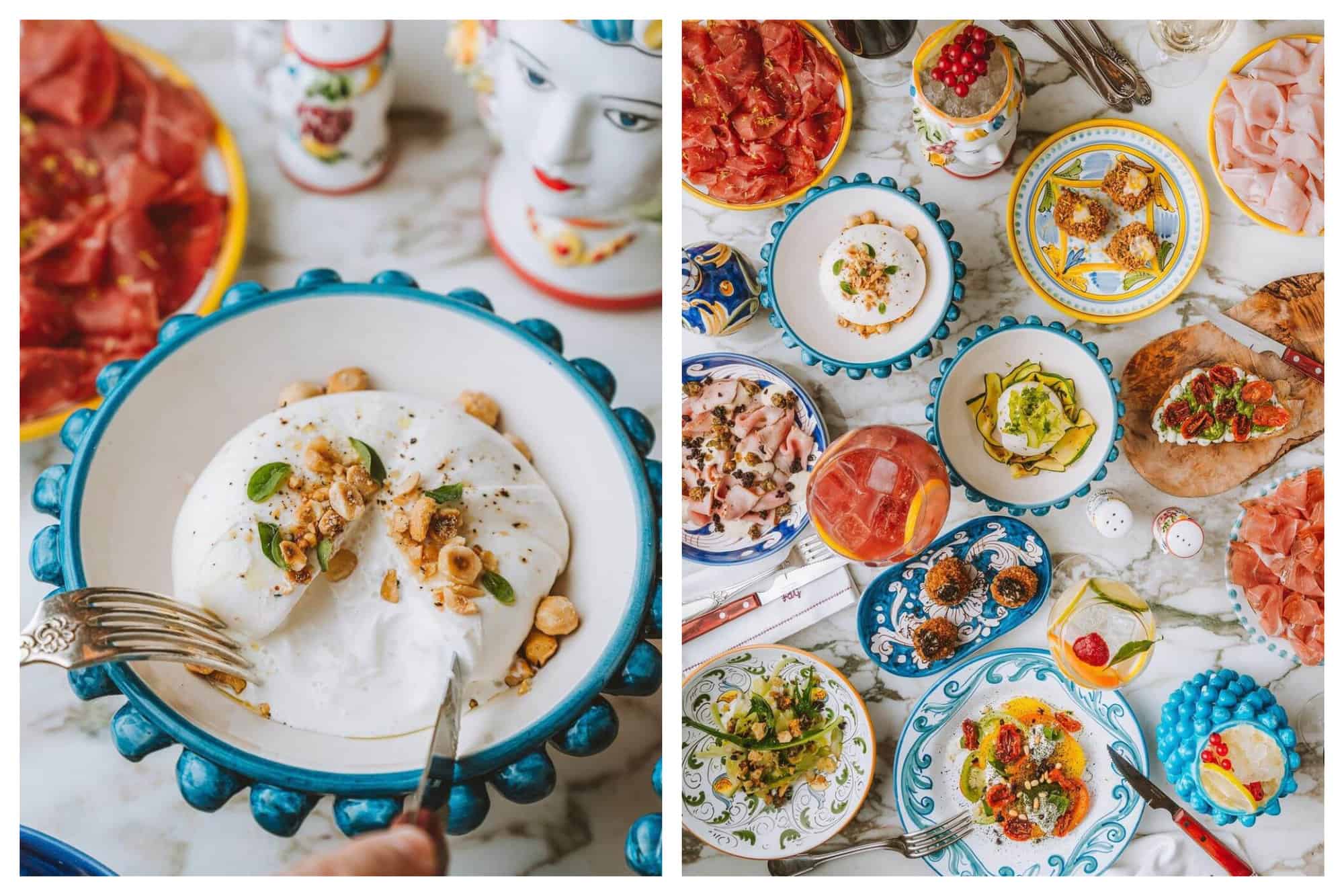 A person cuts into a Burrata with nuts. A colorful spread of anitpasti and salads.