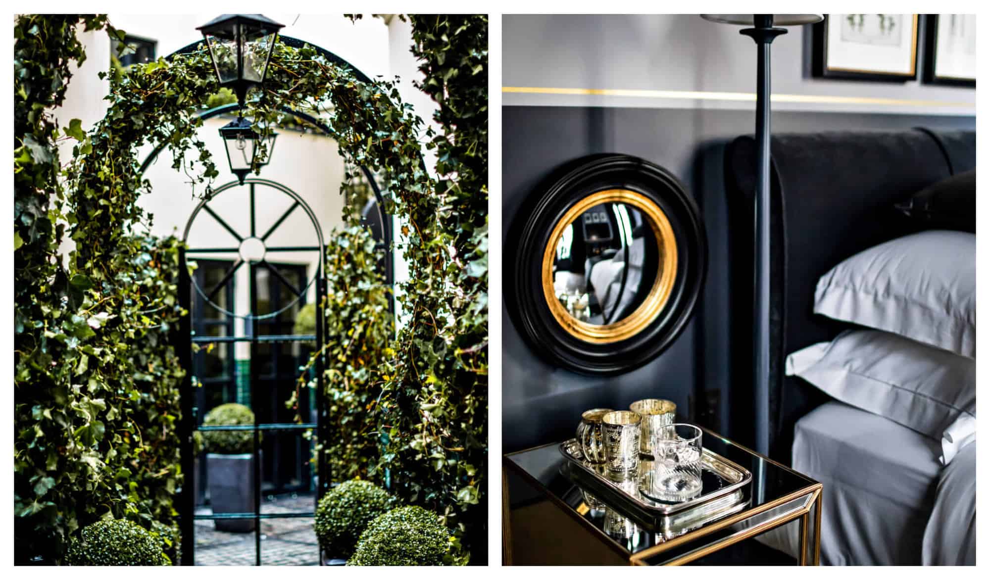 Left: A courtyard gate at Monsieur George hotel and Spa covered with green vines. Right: A bedside table in the hotel with 3 silver mugs, a whisky glass, and a black and brown mirror.