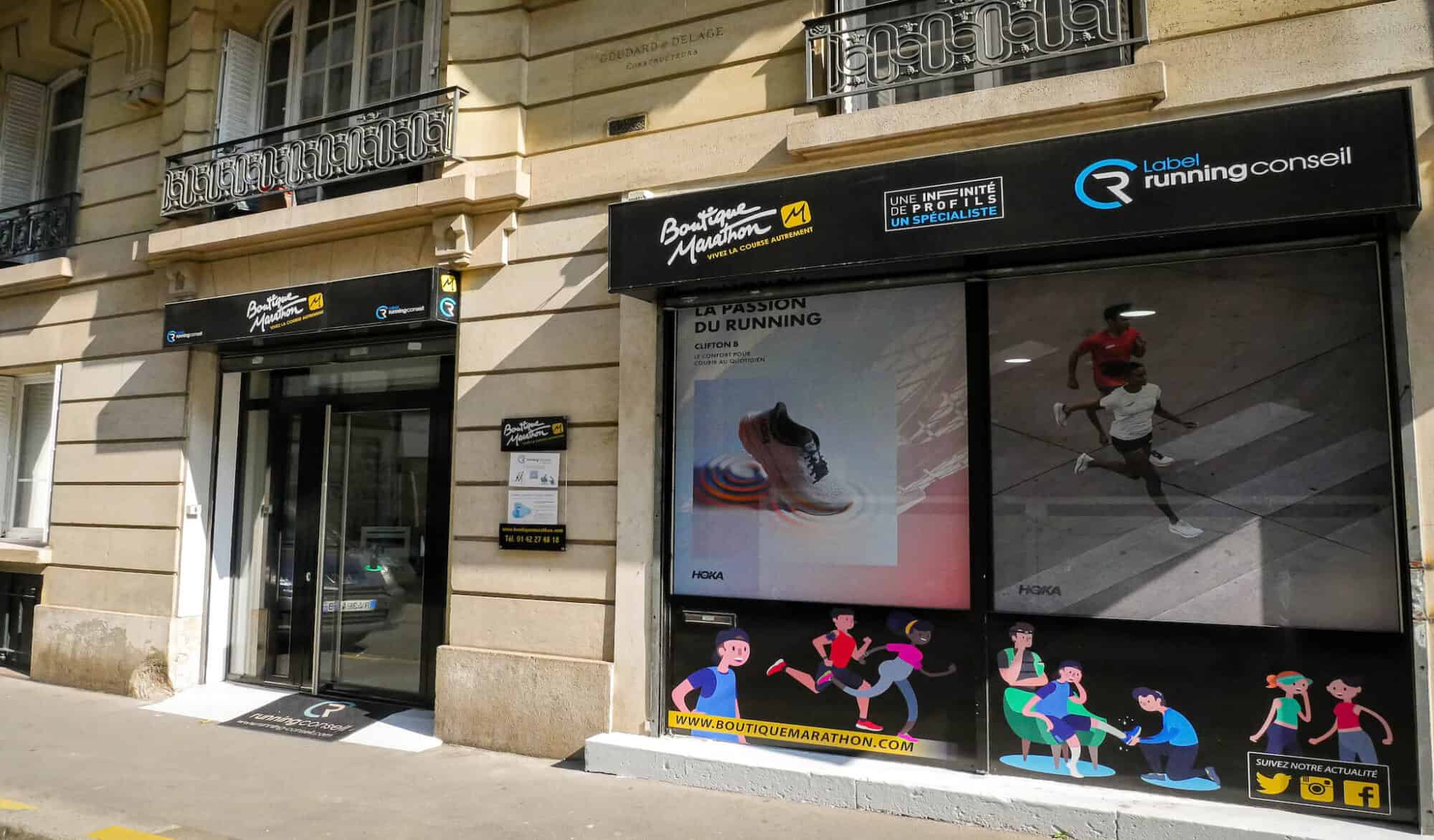 A black store front of a running shop.