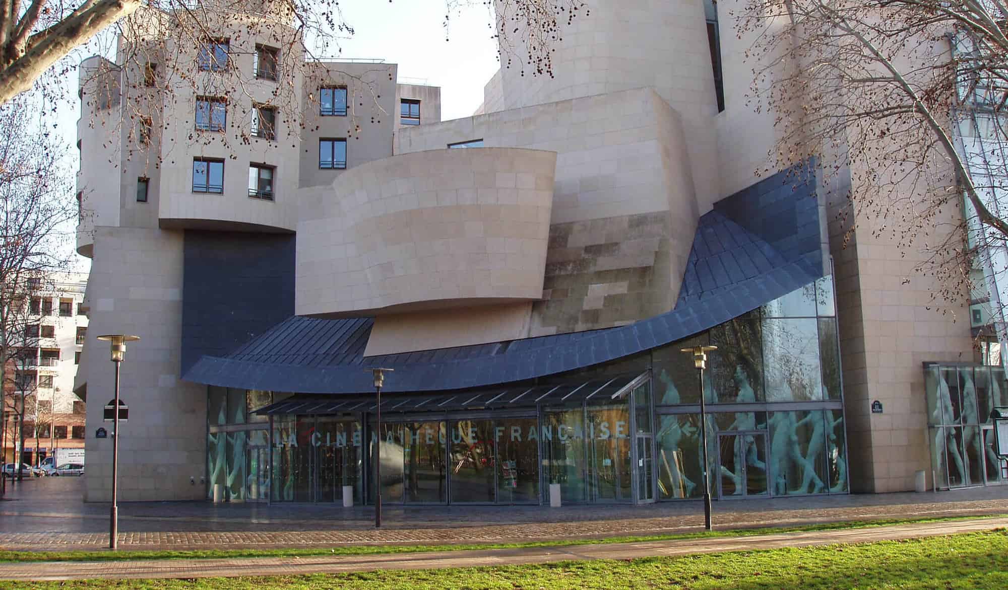 The modern concrete and glass facade of the Cinematheque Francaise in Paris.