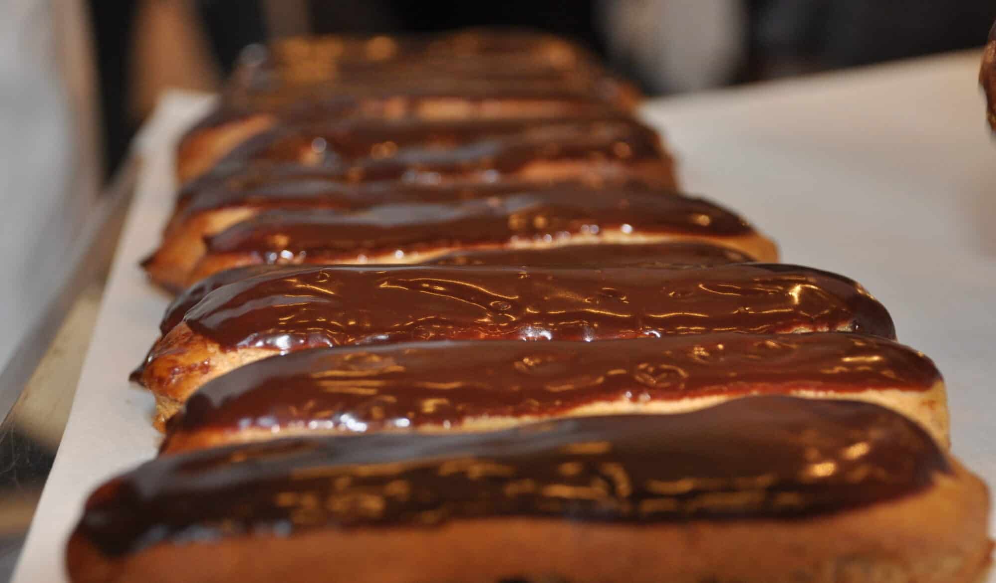A row of chocolate eclairs at the Salon du Chocolat fair.