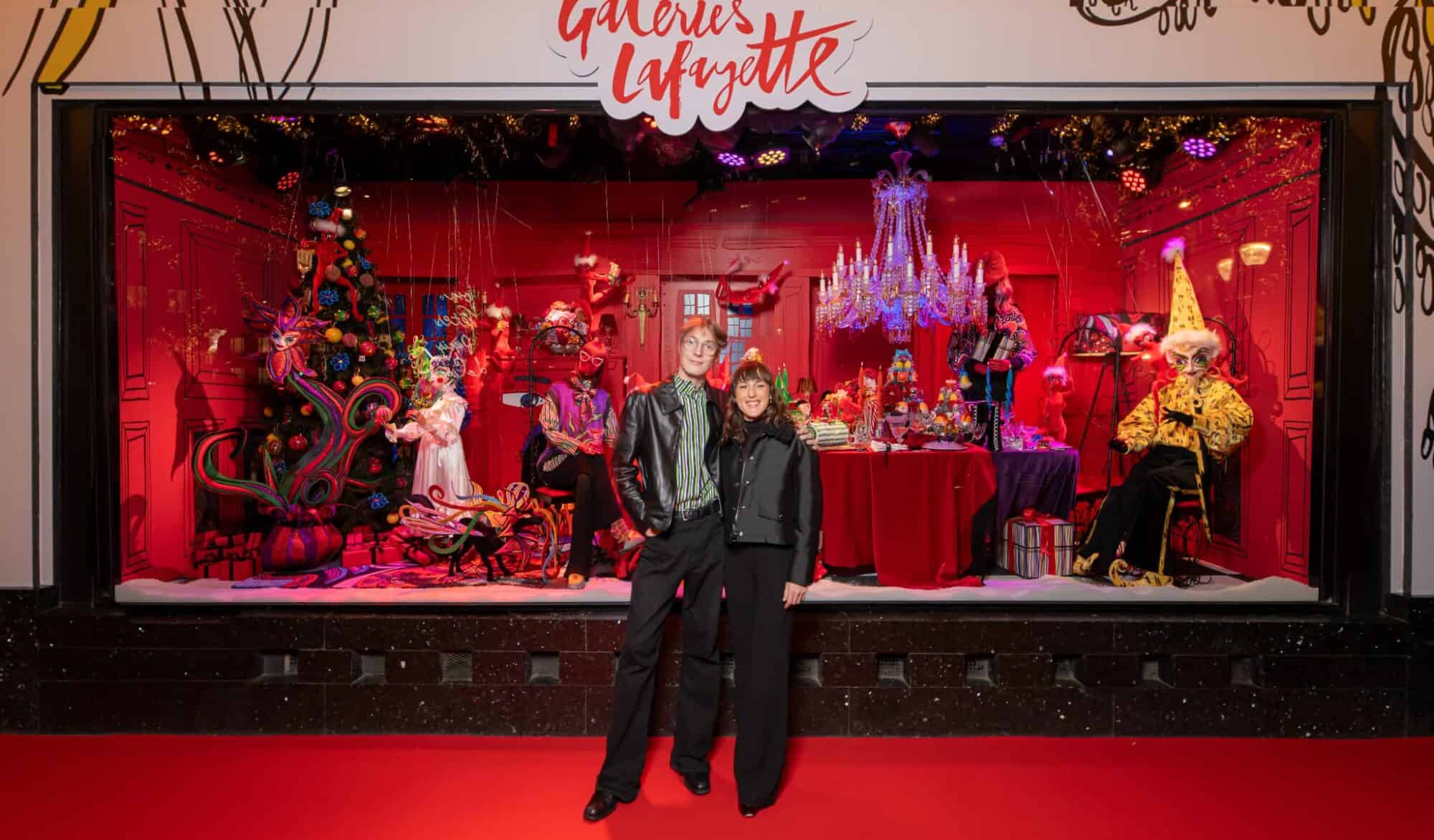 The fashion designer Charles de Vilmorin and singer Juliet Armanet pictured in front of Galeries Lafayette Paris Hausmann's Christmas window display.