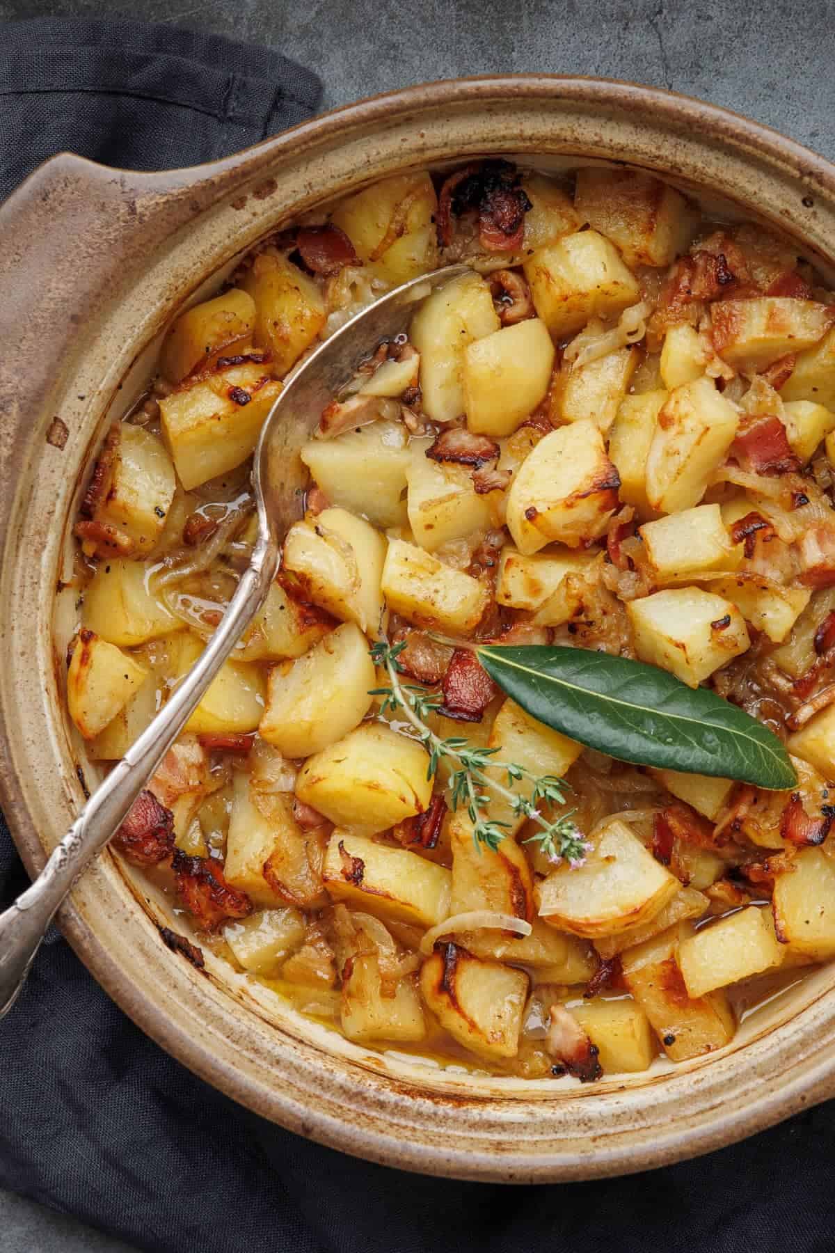 Potatoes Boulangère (Potatoes cooked with bacon, stock and onions)