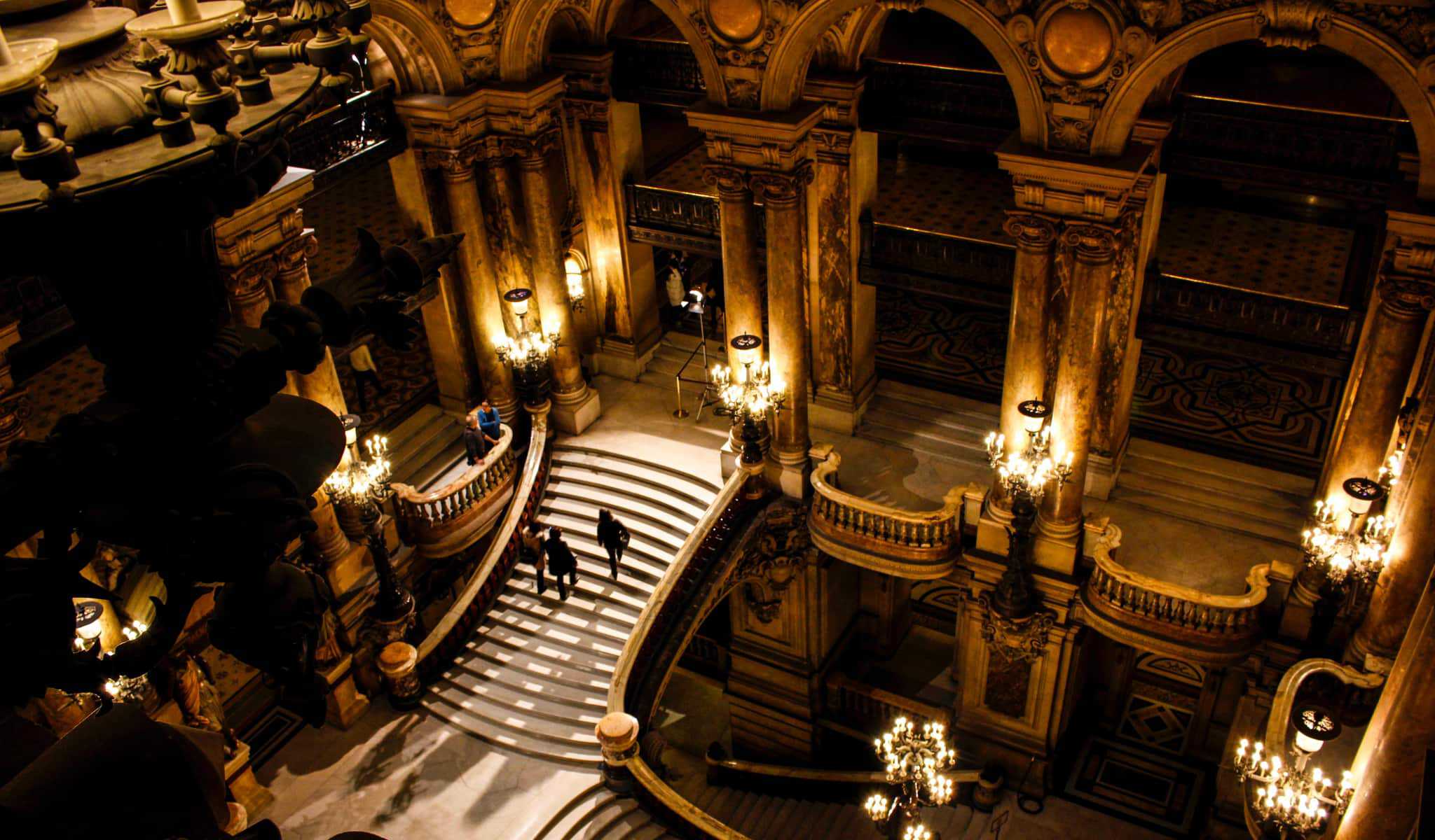 A staircase in Opera Palais Garnier Paris which has gilded interiors reminiscent of the belle epoque