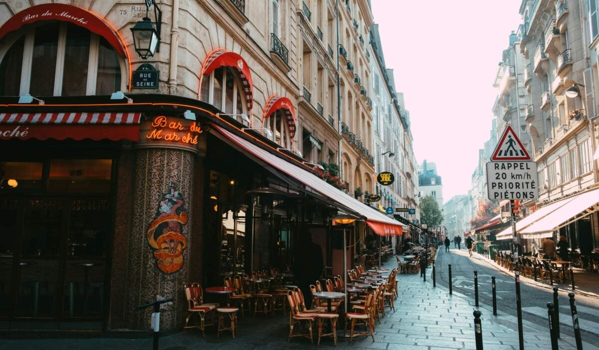 Paris street with cafe terraces at Saint Germaine