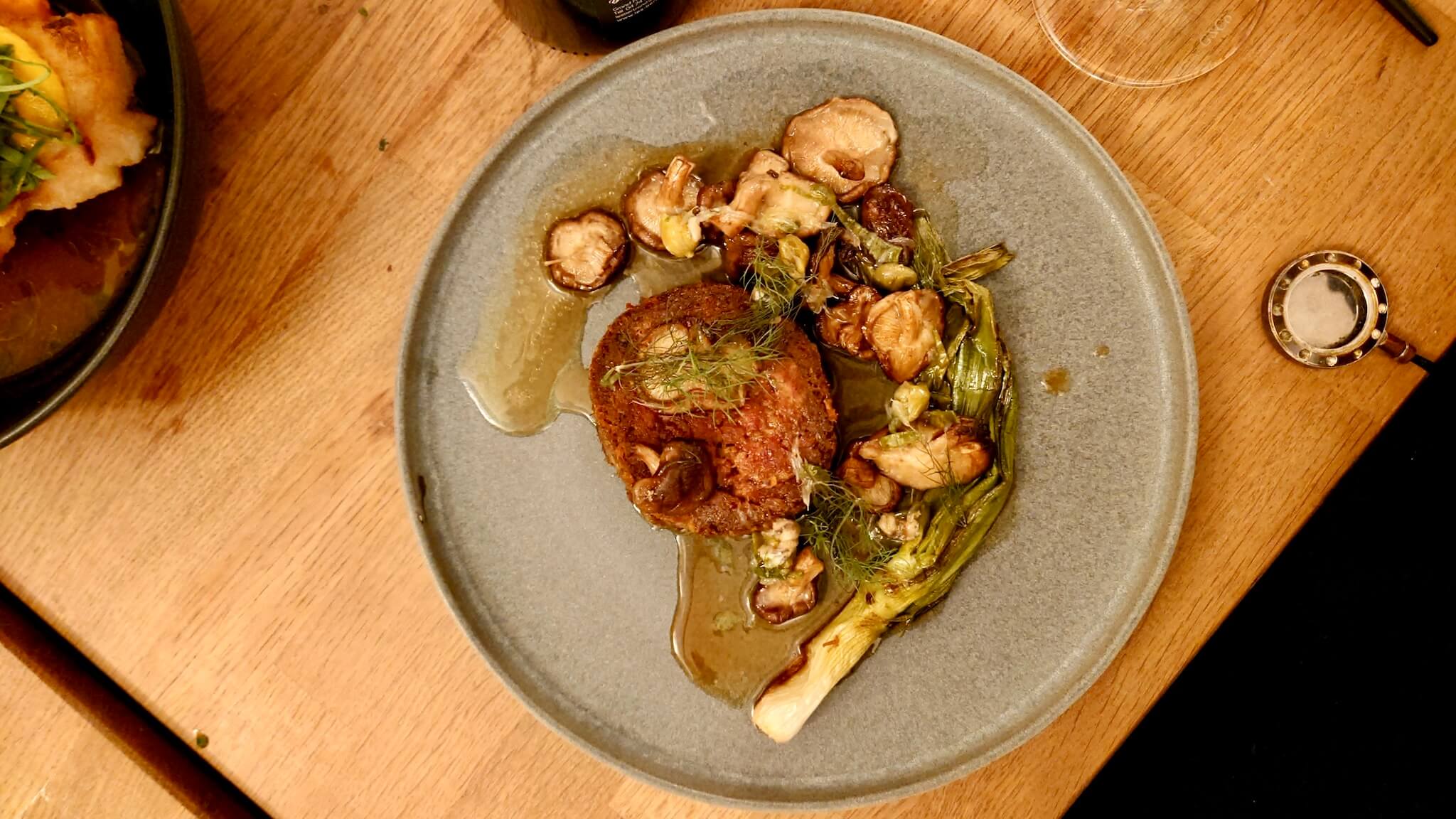 A dish on a wooden table at L'Esquisse.