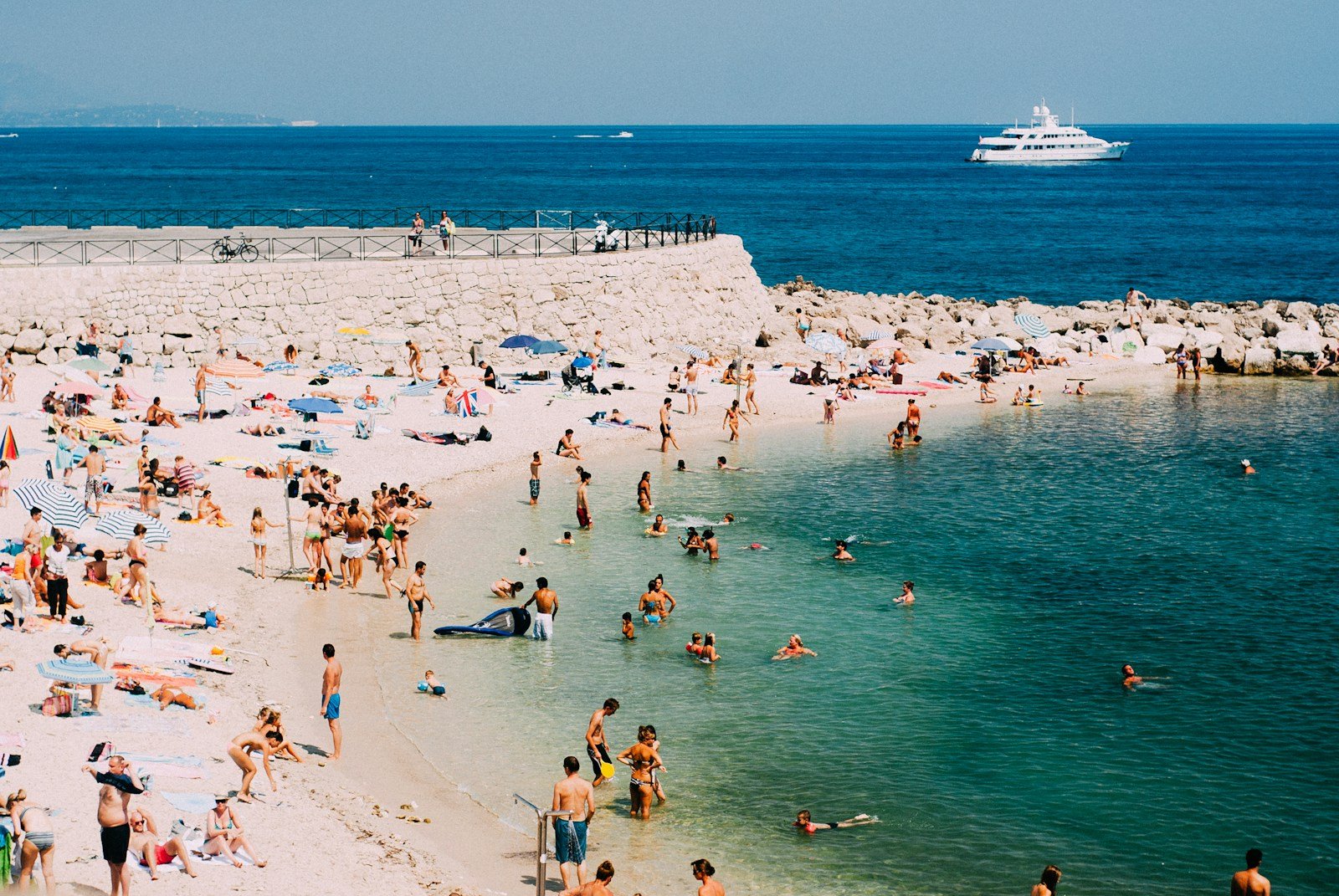 people standing on seashore in France.