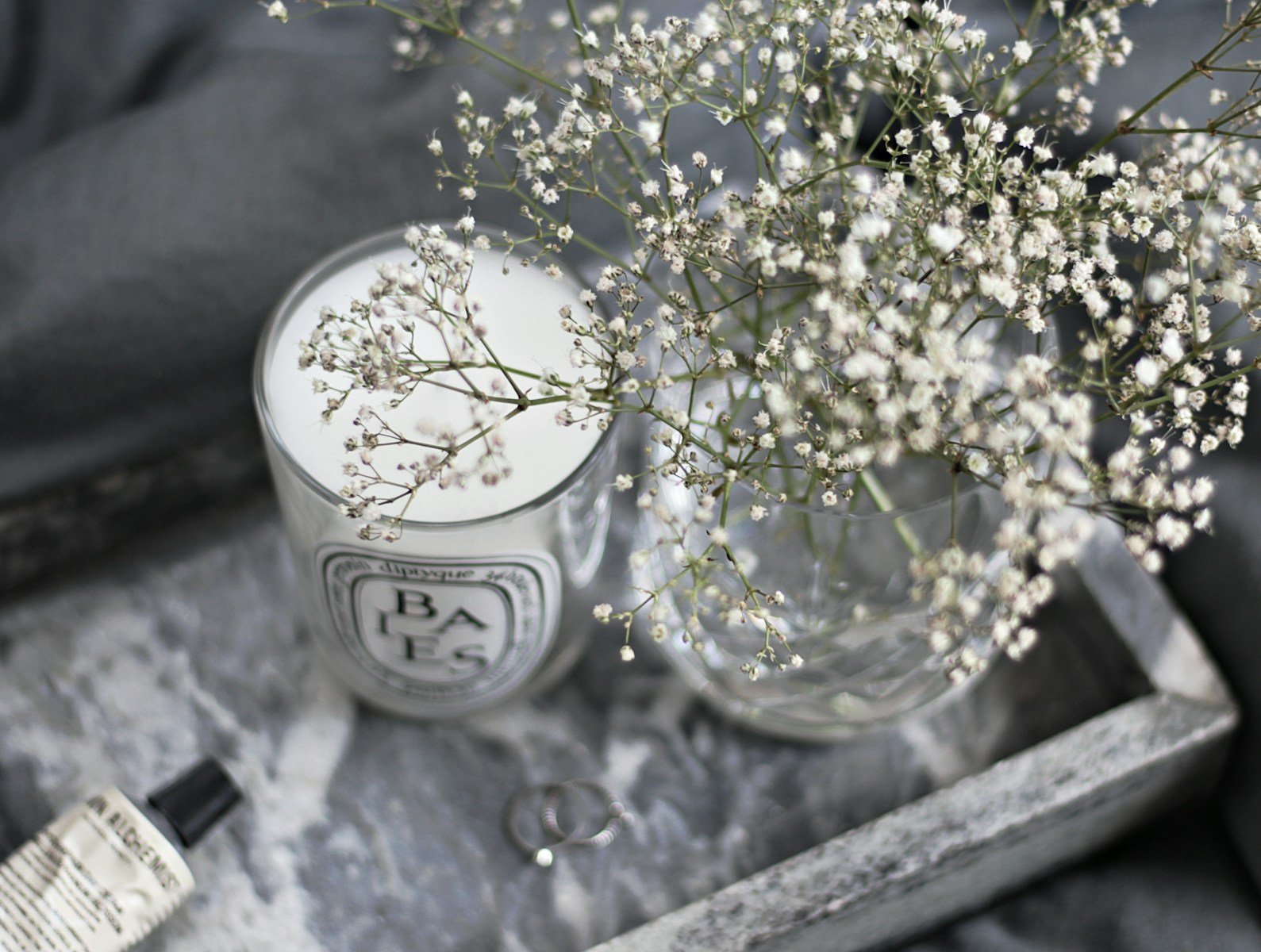white flowers in clear glass vase.