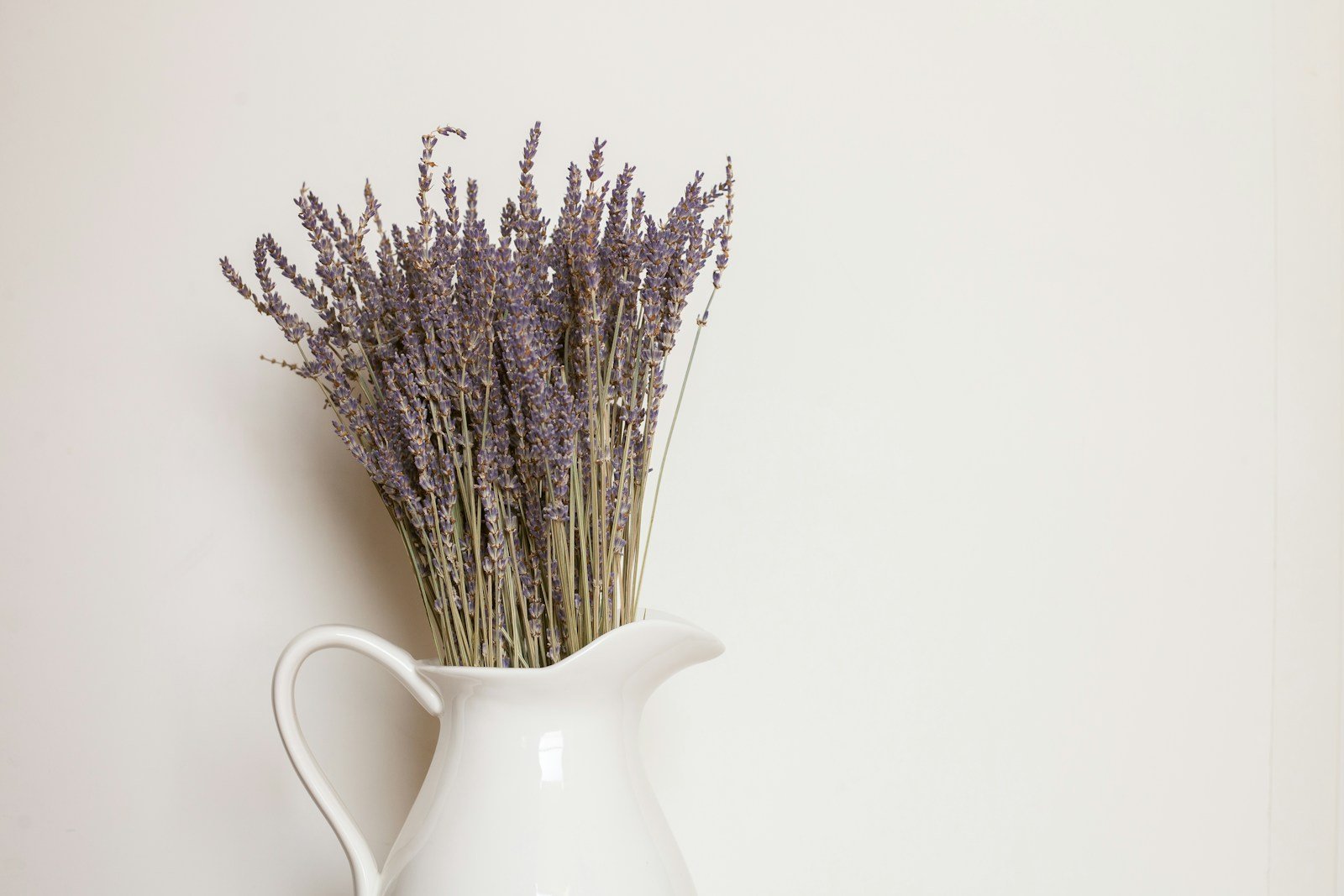 white ceramic vase with dried lavender.