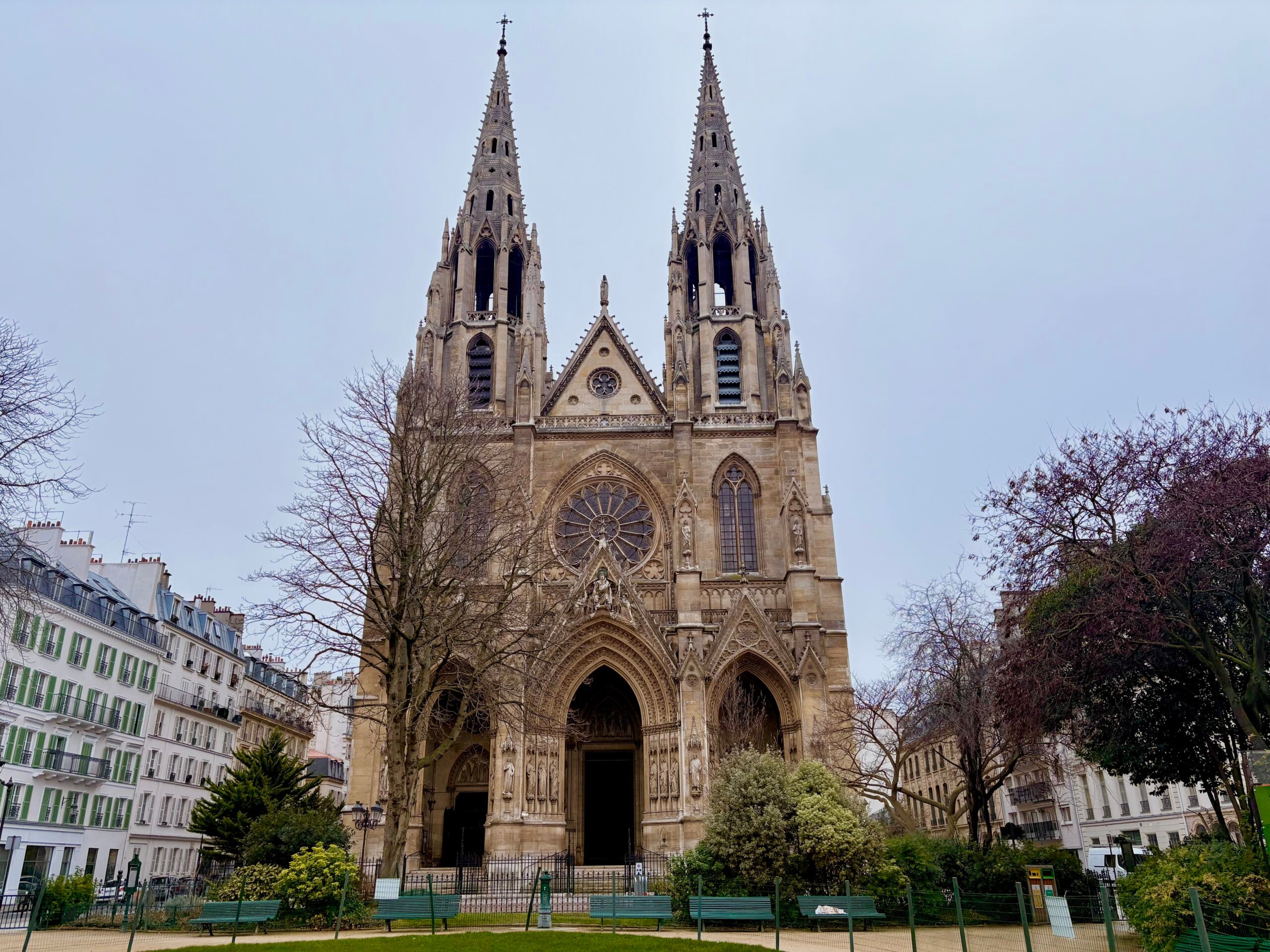 Paris Eglise with a pink spring tree nearby.