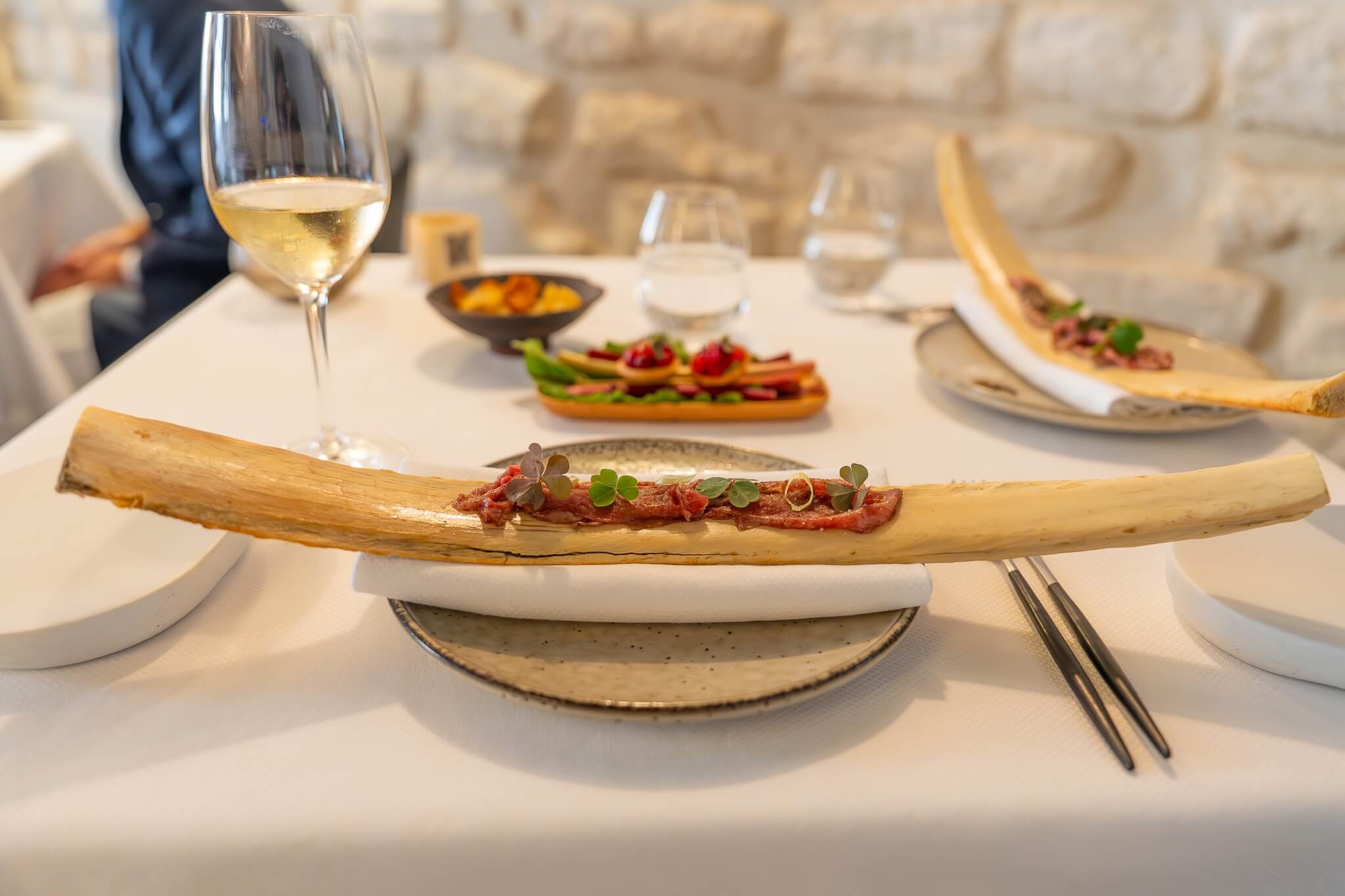 Thin sliced Wagyu beef on a long bone from Pages restaurant. 