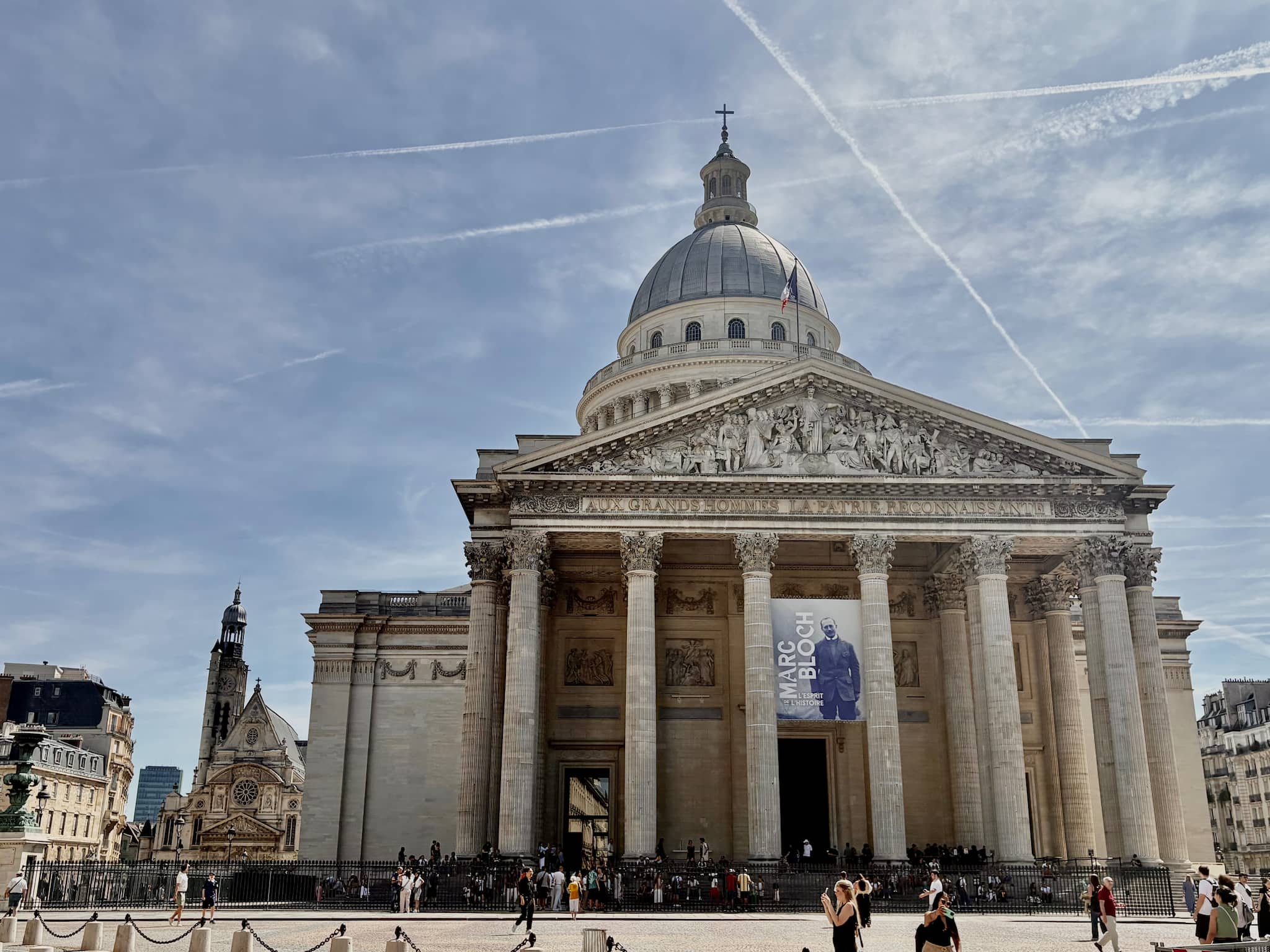 Paris Pantheon view from front with columns under a blue sky