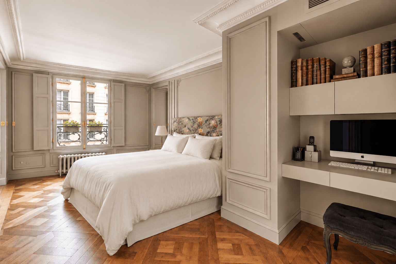 Paris apartment bedroom queen bed and parquet floors